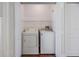 Convenient laundry closet with a side-by-side washer and dryer for efficient home care at 2248 Lake Woodberry Cir, Brandon, FL 33510