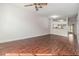 Open-concept living space featuring hardwood floors and neutral decor at 2248 Lake Woodberry Cir, Brandon, FL 33510
