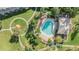 Aerial view of the community pool surrounded by landscaping and walkways at 2248 Lake Woodberry Cir, Brandon, FL 33510