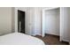 Bedroom features a bed, closet, and easy access to the hallway and adjacent rooms at 2316 Lake Woodberry Cir, Brandon, FL 33510