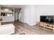Bright and airy living space featuring stylish laminate flooring and a modern aesthetic at 2316 Lake Woodberry Cir, Brandon, FL 33510