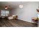 Spacious living room featuring hardwood floors and a modern chandelier at 2316 Lake Woodberry Cir, Brandon, FL 33510