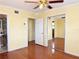 Bedroom featuring hardwood floors, mirrored closet, and access to a bathroom at 2523 Krueger Lane, Tampa, FL 33618
