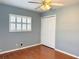 Calm bedroom with wood floors, plantation shutters, and closet space at 2523 Krueger Lane, Tampa, FL 33618