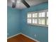Bedroom featuring hardwood floors, a shuttered window, and a ceiling fan at 2523 Krueger Lane, Tampa, FL 33618