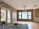 Dining room featuring hardwood floors and large windows at 2523 Krueger Lane, Tampa, FL 33618