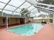 Screened-in pool and patio providing an outdoor space for relaxation and entertainment at 2523 Krueger Lane, Tampa, FL 33618