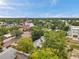 Lovely neighborhood featuring a beautiful church, tree-lined streets, and cozy homes under a blue sky at 2808 N Highland Ave, Tampa, FL 33602