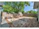 Backyard featuring a mix of concrete slab and patio space with a wooden privacy fence at 2808 N Highland Ave, Tampa, FL 33602