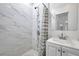 Updated bathroom featuring tiled walls and shower, with a modern vanity and mirror at 2808 N Highland Ave, Tampa, FL 33602