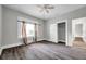 Bedroom featuring dark grey flooring, light grey walls, bright window, and a closet perfect for storing personal items at 2808 N Highland Ave, Tampa, FL 33602