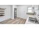 Kitchen featuring a pantry, white cabinets, modern flooring, and open shelves at 2808 N Highland Ave, Tampa, FL 33602