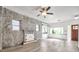 Spacious living room features a stone fireplace and large windows for ample natural light at 2808 N Highland Ave, Tampa, FL 33602