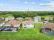 An aerial view of the home, showing its large yard and nearby neighborhood amenities at 28565 Picana Ln, Wesley Chapel, FL 33543