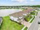 Beautiful lakefront home with paver driveway, lush lawn and located in a desirable community at 28565 Picana Ln, Wesley Chapel, FL 33543
