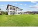 Expansive backyard with lush green grass, perfect for outdoor activities and entertaining at 28565 Picana Ln, Wesley Chapel, FL 33543