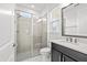Modern bathroom with a glass-enclosed shower, sleek vanity, and updated fixtures at 28565 Picana Ln, Wesley Chapel, FL 33543