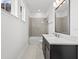 Bathroom featuring a sleek vanity, modern mirror, and tiled shower/tub combination at 28565 Picana Ln, Wesley Chapel, FL 33543
