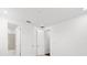 Bright, spacious bedroom with white walls, carpet flooring, and an adjoining bathroom at 28565 Picana Ln, Wesley Chapel, FL 33543