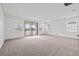 Large bedroom with big windows and lots of light that create an inviting atmosphere at 28565 Picana Ln, Wesley Chapel, FL 33543