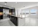 Bright, airy kitchen with a large center island, stainless appliances, and ample natural light at 28565 Picana Ln, Wesley Chapel, FL 33543