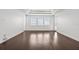 Living room featuring wood floors, recessed lighting and tray ceiling at 28565 Picana Ln, Wesley Chapel, FL 33543