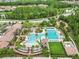 Overhead view of the community pool featuring dedicated lap lanes and a area with a slide for hours of summer fun at 28565 Picana Ln, Wesley Chapel, FL 33543