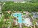 Image showcasing the zero entry community pool with lap lanes, slide and plenty of seating to enjoy at 28565 Picana Ln, Wesley Chapel, FL 33543