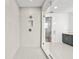 Beautifully tiled shower with glass door and multiple shower heads at 28565 Picana Ln, Wesley Chapel, FL 33543