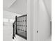 Bright staircase featuring black metal railing and white walls that offer a transition to other rooms at 28565 Picana Ln, Wesley Chapel, FL 33543