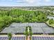 Overhead view of tennis courts, a great recreational amenity for active residents at 28565 Picana Ln, Wesley Chapel, FL 33543