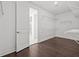 Bright walk-in closet featuring wood floors and ample shelving for optimal organization and storage at 28565 Picana Ln, Wesley Chapel, FL 33543