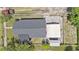 Aerial view of the home showcasing the roof, carport, and surrounding yard at 3008 E Wilder Ave, Tampa, FL 33610