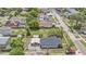Aerial view of a home in a neighborhood showcasing its layout and surroundings at 3008 E Wilder Ave, Tampa, FL 33610