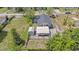 An elevated view of the home highlighting its carport, shed, and expansive backyard at 3008 E Wilder Ave, Tampa, FL 33610