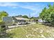 Fenced backyard with a carport and shed at 3008 E Wilder Ave, Tampa, FL 33610