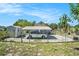 Fenced backyard with a carport and additional storage shed providing ample space at 3008 E Wilder Ave, Tampa, FL 33610