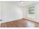 Bedroom with laminate flooring and window views at 3008 E Wilder Ave, Tampa, FL 33610
