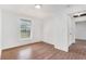 Bright bedroom with laminate flooring and a window providing natural light at 3008 E Wilder Ave, Tampa, FL 33610