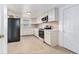 Updated kitchen featuring white cabinets, modern appliances, and stylish backsplash at 3008 E Wilder Ave, Tampa, FL 33610