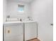 Laundry room with white washer and dryer at 3008 E Wilder Ave, Tampa, FL 33610