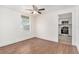Cozy living room displaying wood floors, a window, and a view into the kitchen at 3008 E Wilder Ave, Tampa, FL 33610
