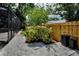 Landscaped backyard with paver patio and privacy fence, perfect for outdoor enjoyment at 3089 Ashland Ter, Clearwater, FL 33761