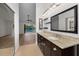 Bathroom view with granite counters, tile floors, and backyard pool access at 3089 Ashland Ter, Clearwater, FL 33761