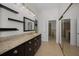 Bathroom with a granite countertop, undermount sink, and tiled floors at 3089 Ashland Ter, Clearwater, FL 33761