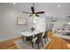 Bright dining room features a marble table, stylish chairs, and wood floors at 3089 Ashland Ter, Clearwater, FL 33761