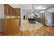 Open concept kitchen with stainless steel appliances, an island with seating, and tile flooring at 3089 Ashland Ter, Clearwater, FL 33761