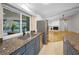 Kitchen sink with granite countertops, stainless steel appliances, and a view of the pool at 3089 Ashland Ter, Clearwater, FL 33761