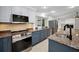 Kitchen showcases granite countertops, stainless steel appliances, and ample cabinet space at 3089 Ashland Ter, Clearwater, FL 33761