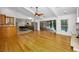 Expansive living area connects to a modern kitchen with seamless access to the outdoor pool area at 3089 Ashland Ter, Clearwater, FL 33761
